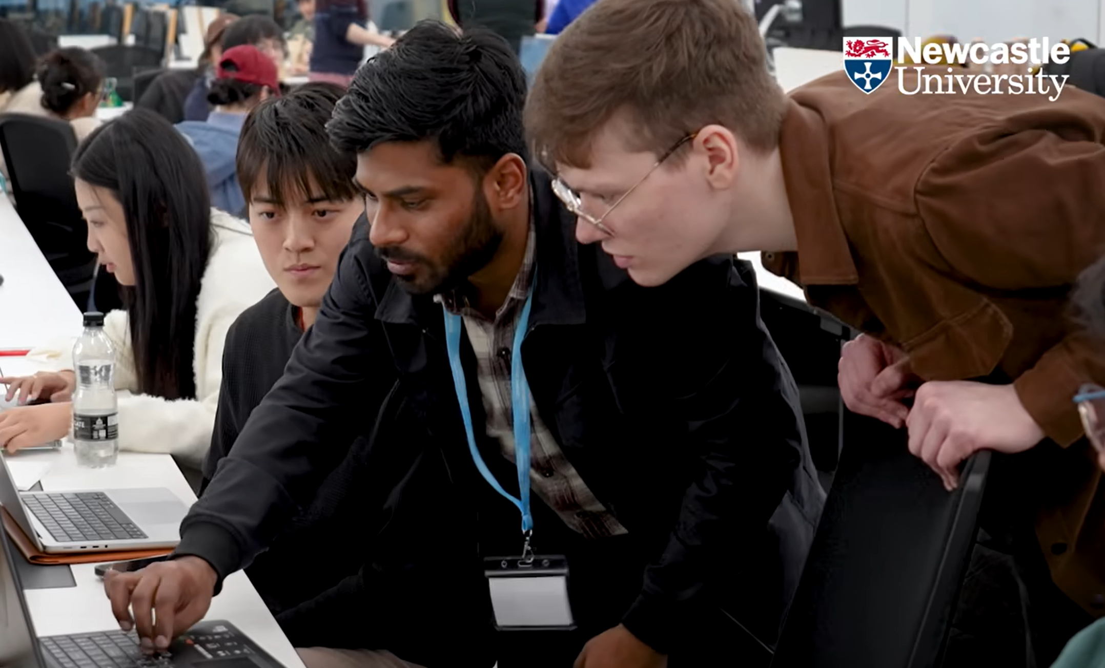 Helping a group of students debug their game at a Newcastle University game jam