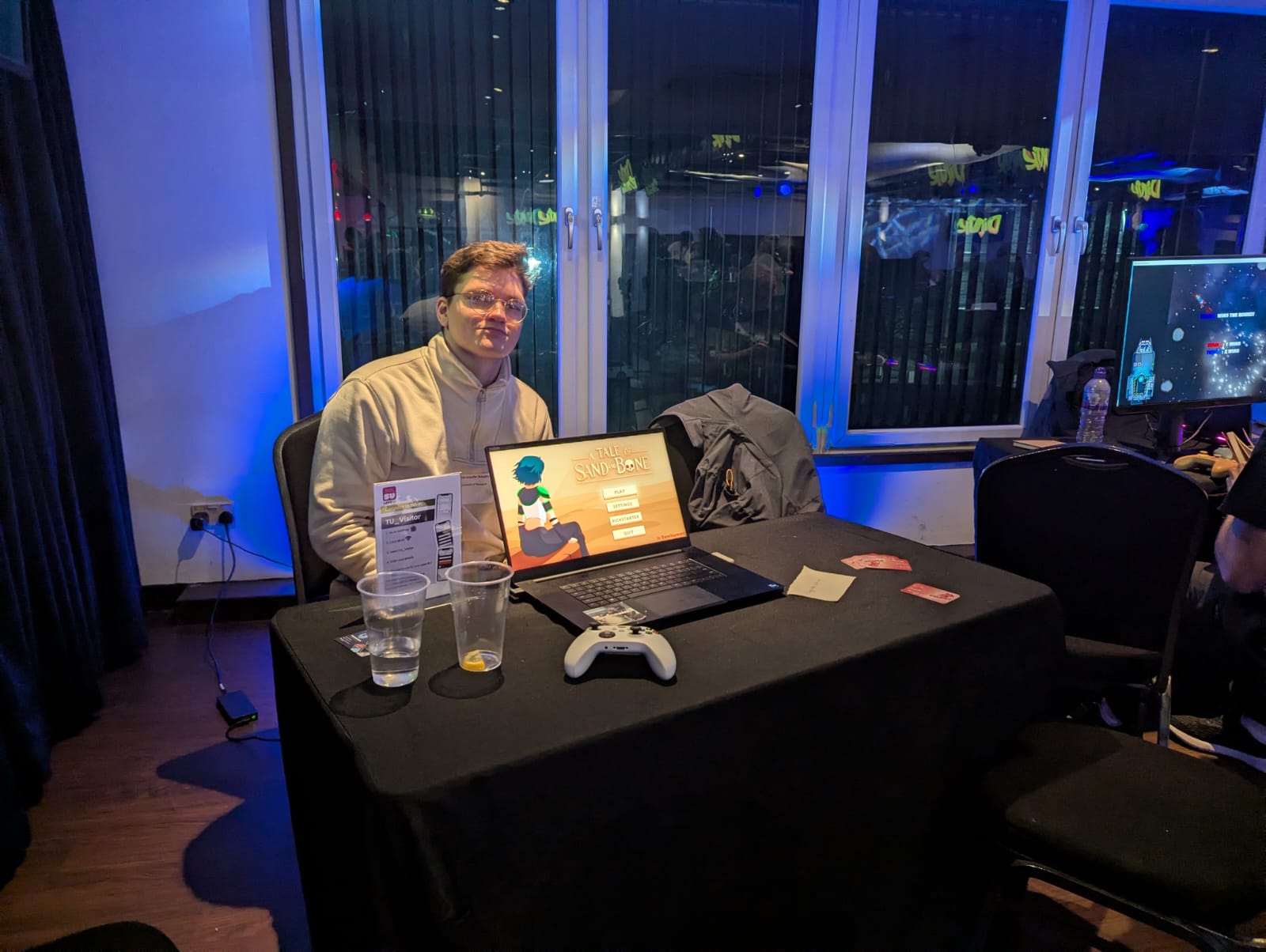 Showcasing A Tale of Sand and Bone at an evening game showcase event